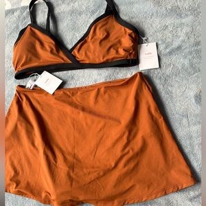 Andie the cove top and the skirt set in color cin. Size large.